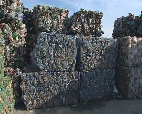 Huge piles of pressed pet bottles prepared for recycling. - Footage, Video