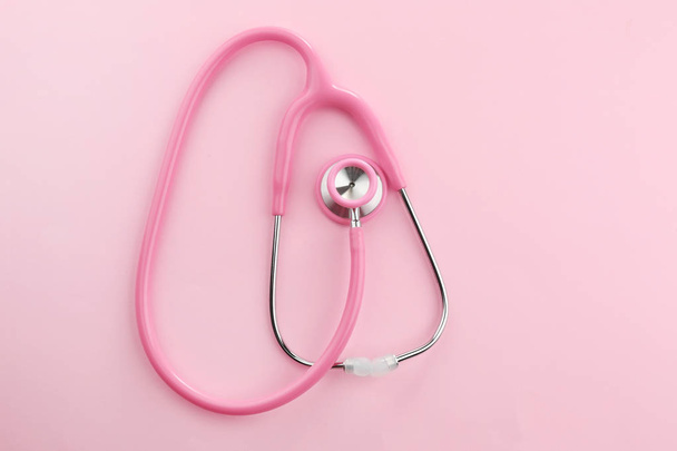 Pink stethoscope on table - Foto, Imagen