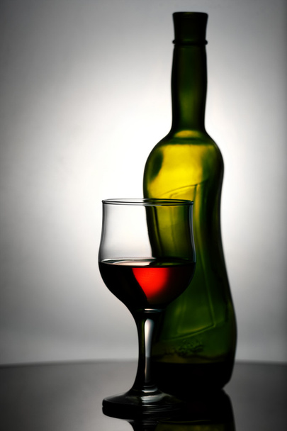 Abstract wine still life over grey backgrounds - Фото, изображение