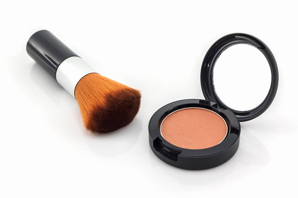 Closeup of face powder and makeup brush. - Фото, зображення