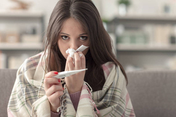 Sick woman taking temperature - Фото, зображення