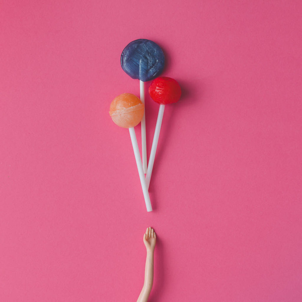 Doll hand with lollipops - Foto, imagen