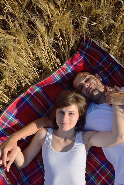 Happy couple in wheat field - Zdjęcie, obraz