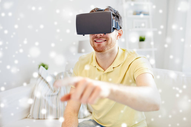 young man in virtual reality headset or 3d glasses - Foto, afbeelding