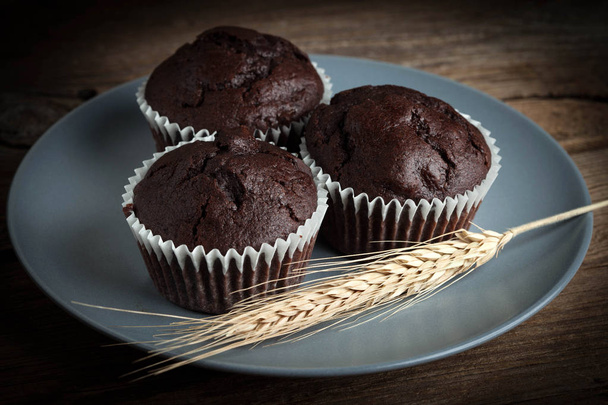 Chocolate muffin on dark background. - Valokuva, kuva