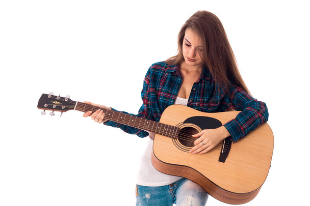 молода чарівна брюнетка з гітарою
 - Фото, зображення