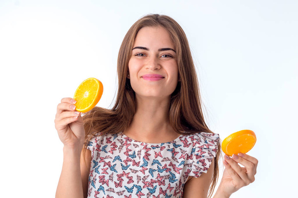 girl with orange slices in hands - Fotó, kép
