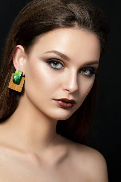 Portrait of young woman with beautiful makeup - Foto, Imagen