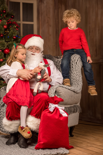 Santa Claus with happy children  - Photo, Image