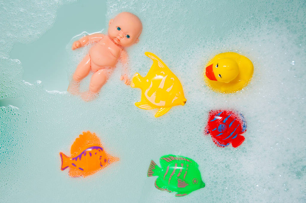 Bath toys in white foam bubbles - Photo, Image