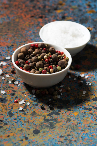 assortment of pepper and sea salt on a dark background, vertical - Photo, image