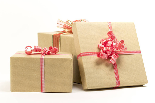 Holiday gift boxes decorated with ribbon isolated on white background. - Fotoğraf, Görsel