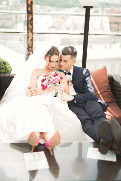Perfect couple bride, groom posing and kissing in their wedding day - Zdjęcie, obraz