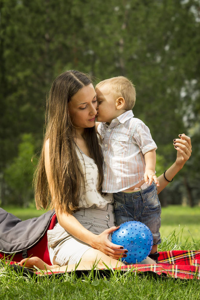 Mother with baby boy in park  - Valokuva, kuva