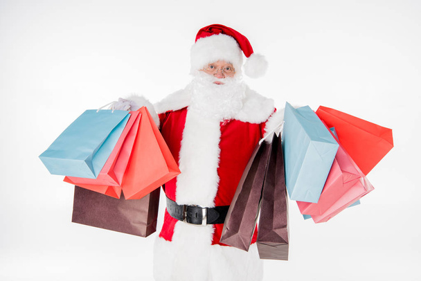 Santa Claus with shopping bags - Фото, изображение