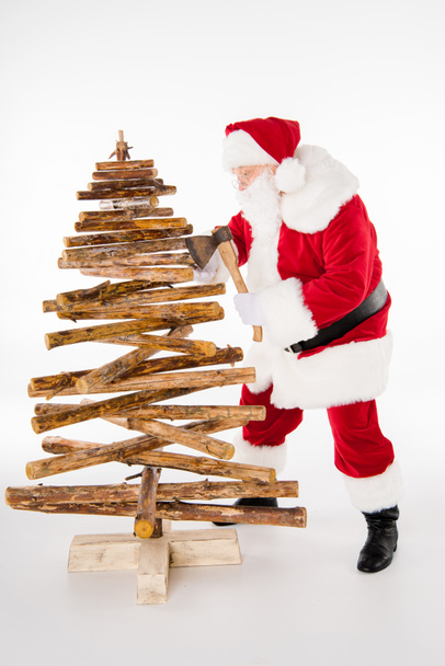 Papai Noel fazendo árvore de Natal
  - Foto, Imagem