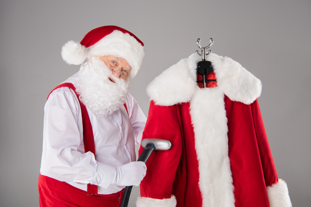 Santa Claus cleaning coat - Photo, Image