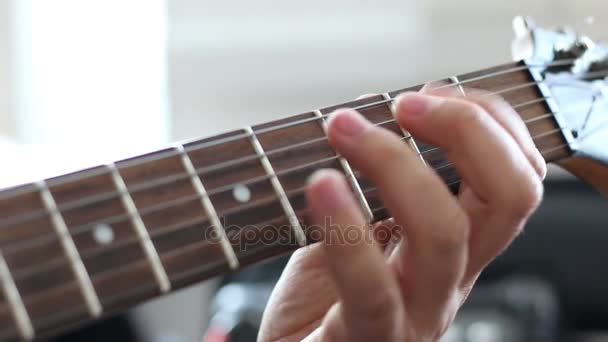 Guitarists hands playing song on electric guitar - Кадри, відео