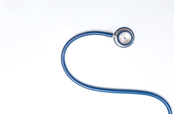 Close up view of blue stethoscope over isolated white background - Photo, Image