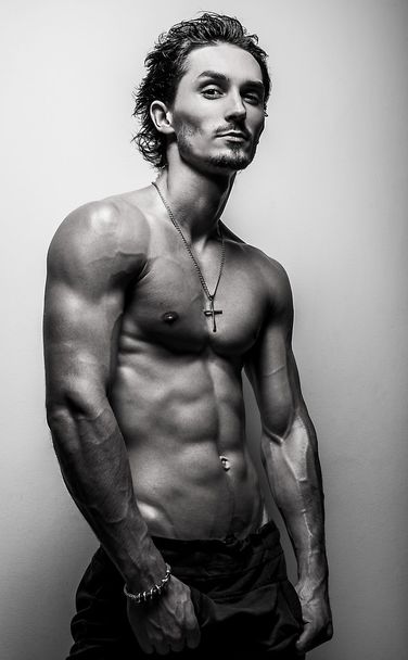 Beautiful and health athletic caucasian muscular young man. Black-white photo. - Φωτογραφία, εικόνα