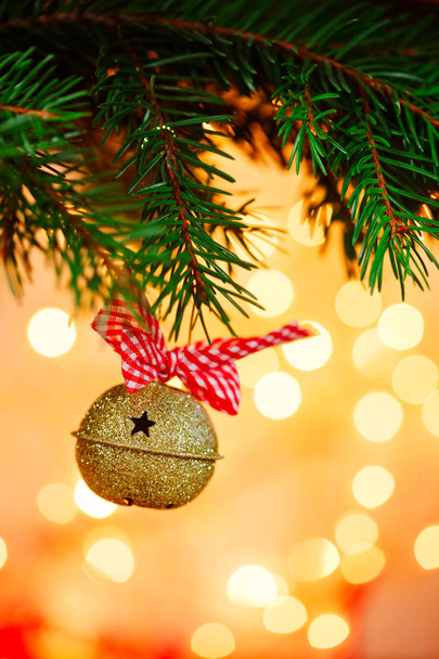 Metal Jingle Bell on Christmas Background spots light. - Φωτογραφία, εικόνα