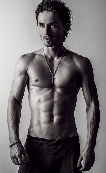 Beautiful and health athletic caucasian muscular young man. Black-white photo. - 写真・画像