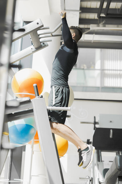 Young handsome man working out in a  gym - Photo, image