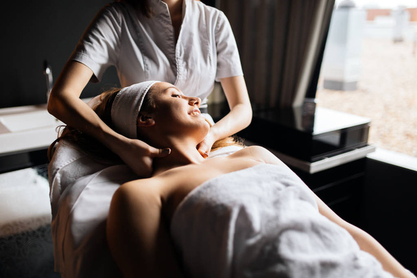 Massage therapist massaging woman - Фото, зображення