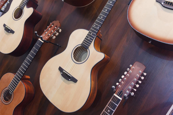 Classical acoustic guitars in musical store. Music - Photo, Image