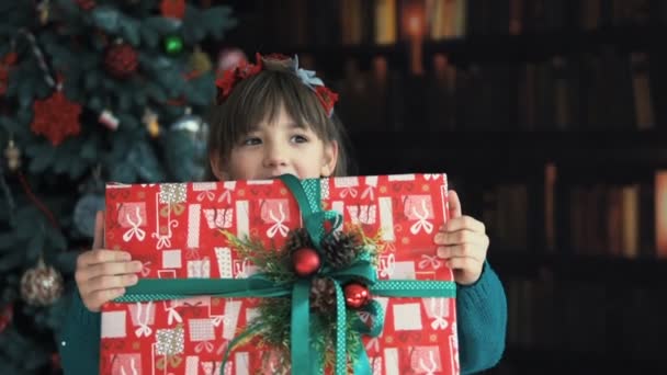 Girl Surprized by Gift Box - Filmati, video