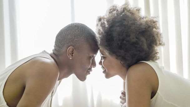 African couple in love in bed - Valokuva, kuva