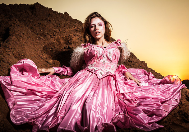 Attractive romantic woman on beautiful pink dress pose outdoor. - Foto, Imagem
