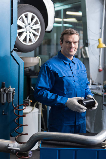 Delighted mechanic holding tool - Photo, Image