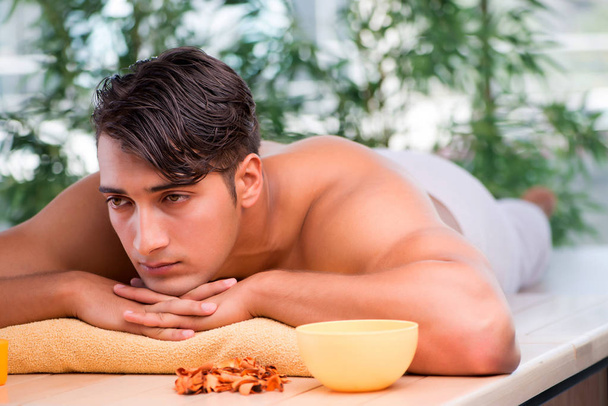 Young handsome man during spa procedure - Photo, Image