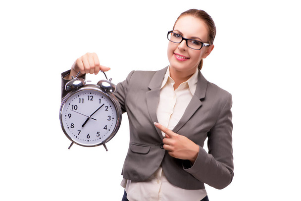 Businesswoman with giant alarm clock isolated on white - Photo, image