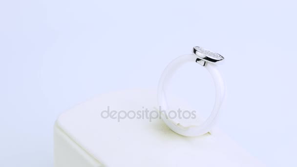 a white ring is with small diamonds on white background - Video