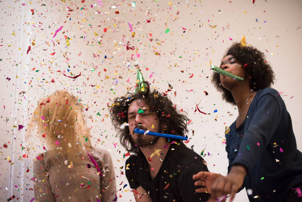 confetti party happy young people - Фото, изображение