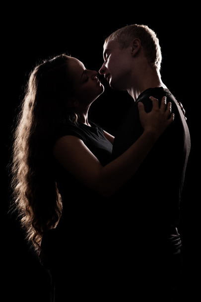 silhouette of romantic couple over black - Photo, Image