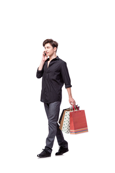 Fiatal férfi vásárlás koncepció elszigetelt fehér - Fotó, kép