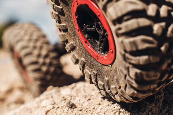 Closeup of 4x4 truck tire on rock track - Photo, Image