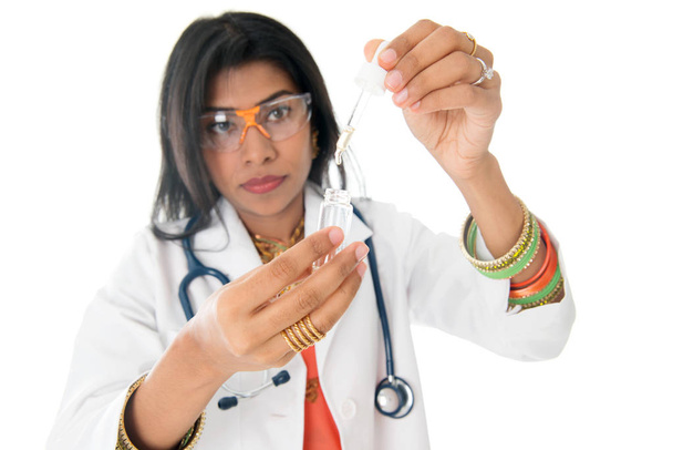 Female medical doctor with test sample - Φωτογραφία, εικόνα
