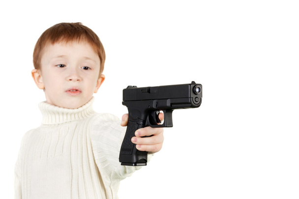 Boy with pistol - Foto, afbeelding