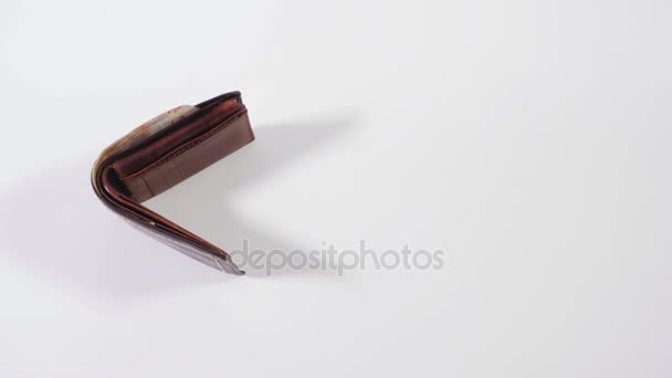 Leather wallet chasing money. The money goes quickly. Stop motion - Video, Çekim