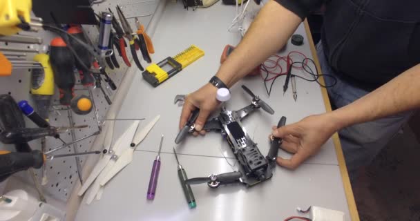 repair maintenance drone,  opening arm, locking screws,  screwdrivers, tools, propellers - Footage, Video