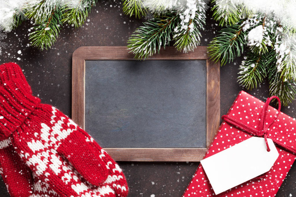 Christmas gift, mittens and chalkboard - Valokuva, kuva