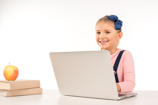 Smiling schoolgirl with laptop - Φωτογραφία, εικόνα