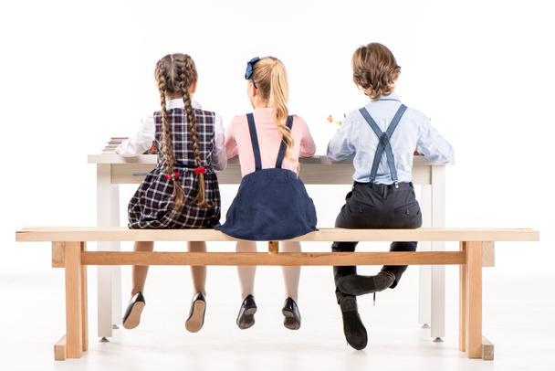 Schoolchildren studying at desk - Photo, Image