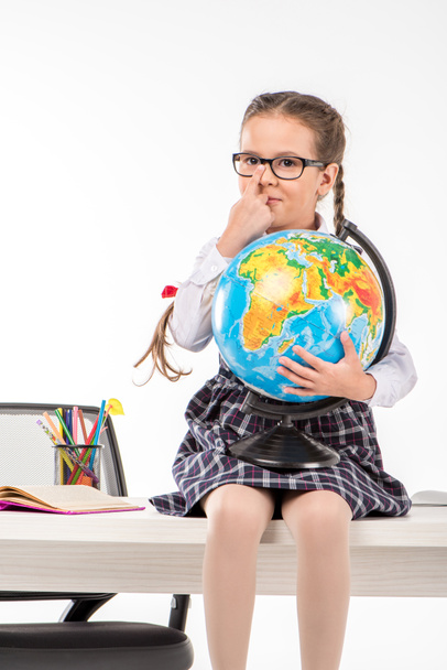 Schoolgirl holding globe  - Fotoğraf, Görsel