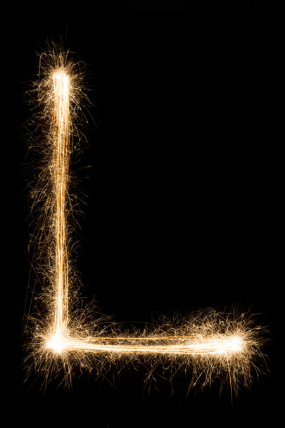 Lettera inglese L da sparklers alfabeto su sfondo nero
. - Foto, immagini