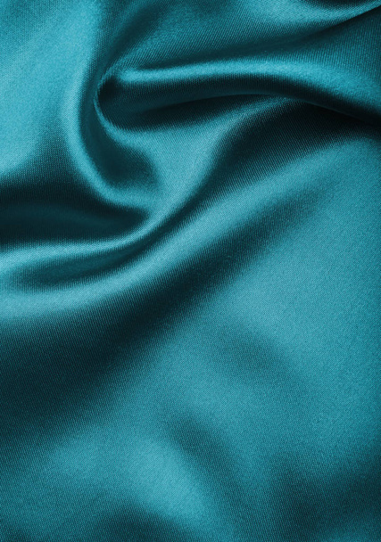 Smooth elegant blue silk or satin texture as abstract background - 写真・画像